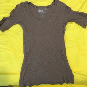 Short to mid sleeve brown shirt with pocket